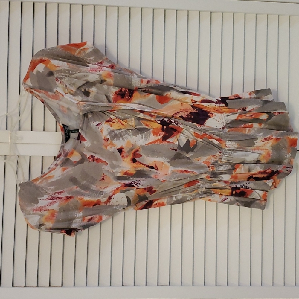 Daisy Fuentes short-sleeve, peplam top. Grey, orange pink.